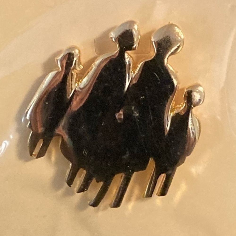 Golden crowd of people. Could be a family. Brooch